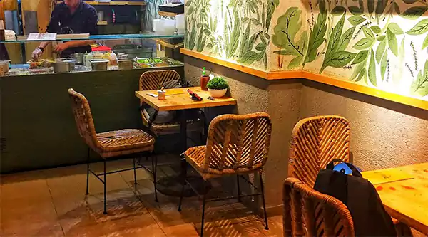 Indoor seating area at Flaxitup healthy restaurant in Mumbai