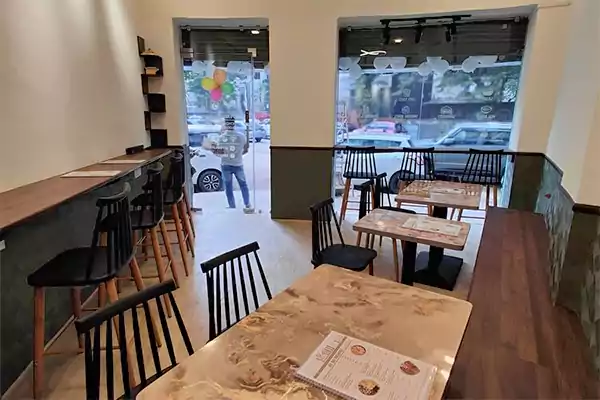 Modern dining area inside Toss Fit healthy food restaurant in Mumbai
