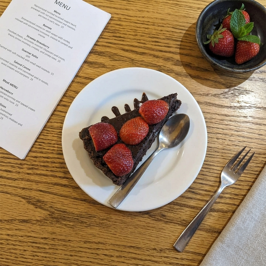 Chocolate tart garnished with fresh strawberries