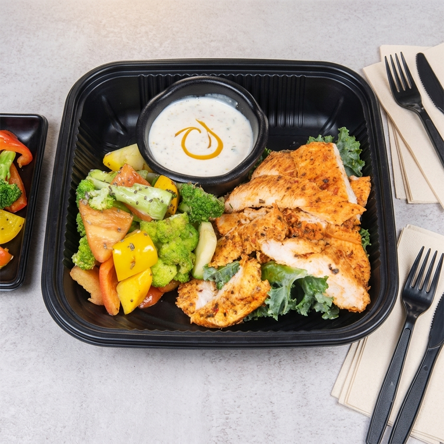 Grilled chicken salad bowl with steamed broccoli, bell peppers, and creamy dressing.