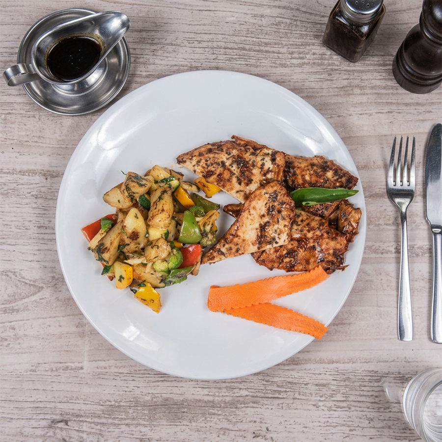 Protein-rich chicken steak with sautéed peppers, broccoli, and carrot ribbons.
