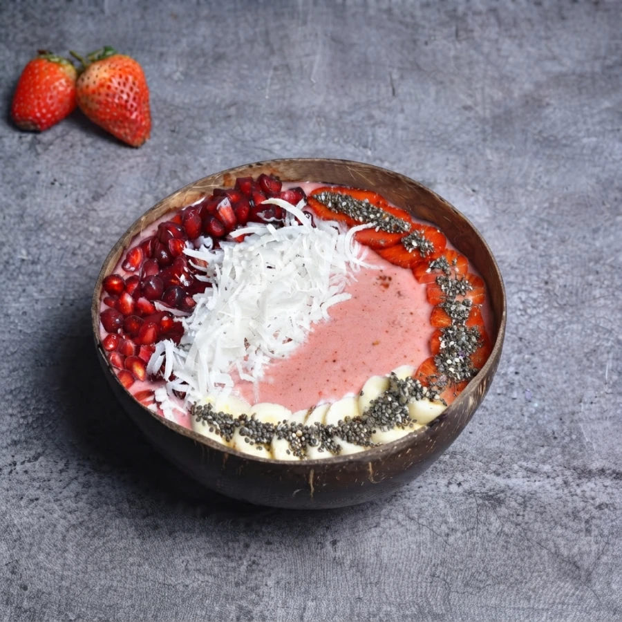 The Classic Smoothie Bowl with Pomegranate, Strawberry, and Banana on the side.